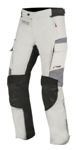 White and black Aplinestars Andes V2 motorcycle pants.