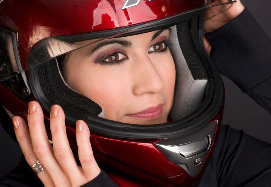Girl using full face motorcycle helmet