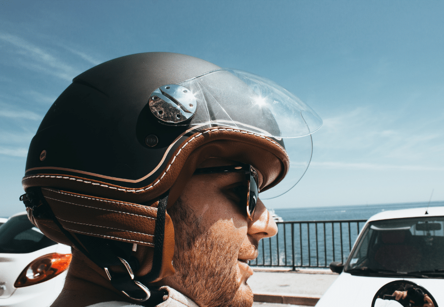 Man using a half face motorcycle helmet